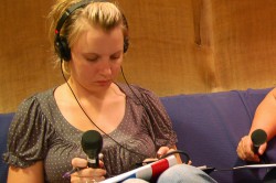 Citizen journalist Lora Smith prepares for radio reporting.